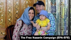 Nazanin Zaghari-Ratcliffe (left) poses with her husband, Richard Ratcliffe, and daughter, Gabriella, in an undated photo.