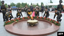 Kyrgyz soldiers lay a wreath at the "eternal flame" monument during WWII Victory Day celebrations in Bishkek last year.