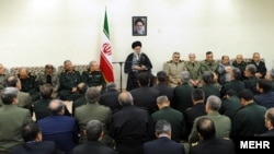 Iranian Supreme Leader Ayatollah Khamenei (center) speaks to armed forces commanders in April.