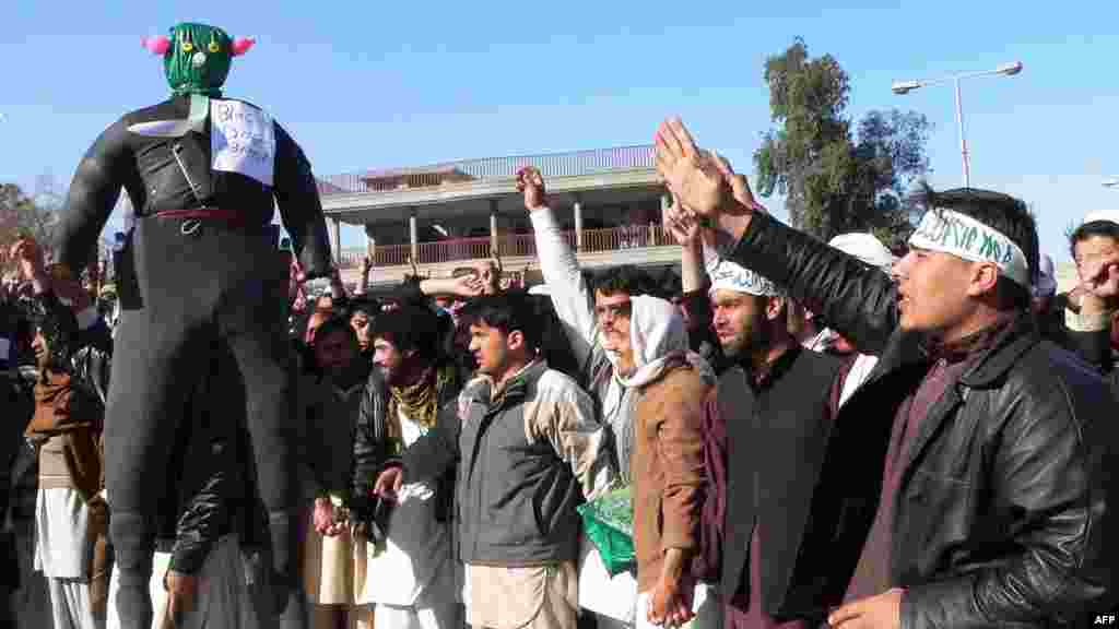 Demonstrators parade an effigy of U.S. President Barack Obama as they shout anti-U.S. slogans during a protest in Jalalabad on February 22 against the reported Koran desecrations.