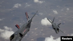 Two F-35 Lightning II planes, produced by Lockheed Martin, arrive at Edwards Air Force Base in California.