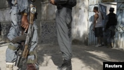 Afghan police at the scene of a suicide bomb attack in Kandahar in October