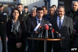 Pro-Kurdish Peace and Democracy Party (BDP) co-chairman Selahattin Demirtas (center) with pro-Kurdish politicians at a press conference in Istanbul (file photo)