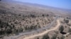 PAKISTAN -- Pakistani soldiers patrol next to a newly fenced border fencing along with Afghan's Paktika province border in Angoor Adda in Pakistan's South Waziristan tribal agency, October 18, 2017