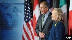 U.S. Secretary of State Hillary Clinton poses with Russian Foreign Minister Sergei Lavrov in Washington in April