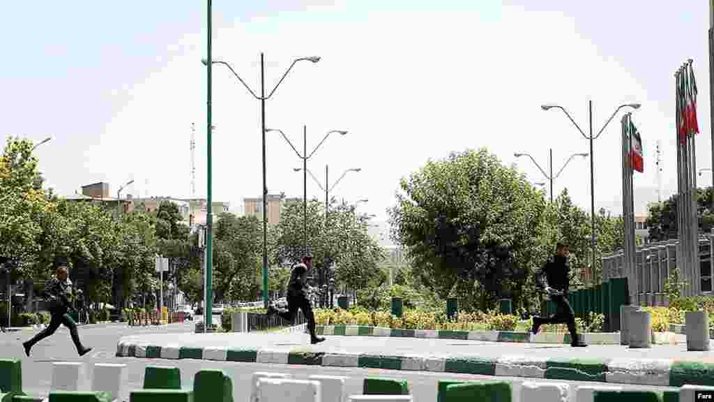 Iranian police run into position near Tehran&#39;s parliament building. &nbsp;