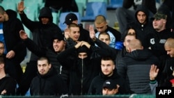 Bulgaria's game against England was halted twice due to abuse from sections occupied by supporters of the Bulgarian team, including monkey chants and apparent Nazi salutes. 