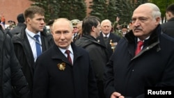 Russian President Vladimir Putin (left) and Belarusian strongman Alyaksandr Lukashenka attend Victory Day events in Moscow on May 9. 