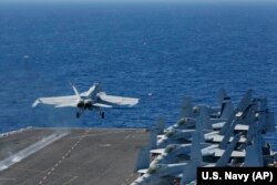 The Pentagon on May 10 said the USS Arlington amphibious assault ship will join the USS Abraham Lincoln Carrier Strike Group (above) and a B-52 bomber task force already headed toward the Persian Gulf. (file photo)