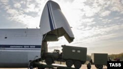 Military equipment is loaded aboard an Antonov An-124-100 heavy transport aircraft. (file photo)