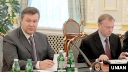 Then-Ukrainian President Viktor Yanukovych (left) and then-Justice Minister Oleksandr Lavrynovych in Kyiv in June 2011