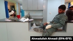 Afghan police officers who were injured in the attack receive medical treatment at a hospital in Paktia.