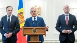 Democratic Party leaders Vladimir Plahotniuc (center), Andrian Candu (left), and Pavel Filip attend a press conference after meeting with the president in Chisinau on April 2, 2019.