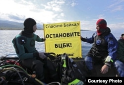 Greenpeace activists prepare to dive into Lake Baikal to protest the Baikal pulp and paper mill's effect on the freshwater lake in 2011.