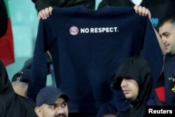 A Bulgaria fan holds up a "No respect" shirt during the game on October 14.