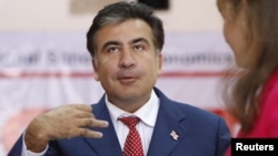 President Mikheil Saakashvili speaks at a polling station during the parliamentary elections in Tbilisi on October 1, 2012.