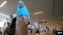 Pilgrims from Iran arrive at Jeddah airport in Saudi Arabia on October 30. More than 500 have now been sent back home, Iran says.