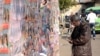 Iran – An Iranian man looks at electoral posters for parliamentary elections in Iran, Rasht, 28Feb2012 