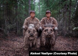 Twins Semyon and Stepan play dulganchas -- mythical swamp creatures -- during a film shoot.