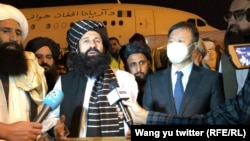 Taliban Refugees Minister Khalil ur-Rahman Haqqani receives a shipment of humanitarian aid from Chinese diplomats at Kabul airport on September 30.