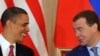 Barack Obama and Dmitry Medvedev are all smiles as they sign a nuclear disarmament treaty in Prague.