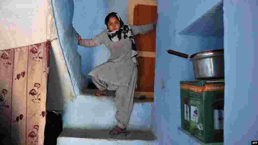 Eleven-year-old Akbari, the &quot;girl in green dress,&quot; at her home in Kabul on April 17. (AFP/Shah Marai)