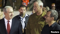 Even as Israel's Prime Minister Benjamin Netanyahu (left) continues to talk of a "red line" Iran's nuclear program must not cross, Defense Minister Ehud Barak (right) has suggested that that line may have moved.