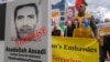 Iranian opposition activists protest with a portrait depicting Iranian official Asadollah Assadi in Brussels in October 2018.