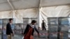 Afghan election workers move ballot boxes to the Independent Election Commission (IEC) warehouse in Kabul on September 19 in preparation for counting.