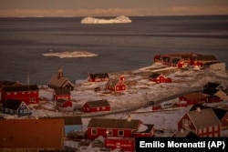 An iceberg is photographed near the city of Ilulissat, Greenland, on February 19.