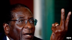 President Robert Mugabe's opponents say the meeting with Ahmadinejad further isolates ZImbabwe.