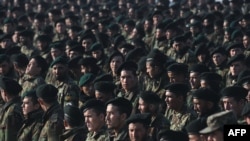 Newly graduated Afghan National Army soldiers attend their graduation ceremony at a training center in Kabul in January