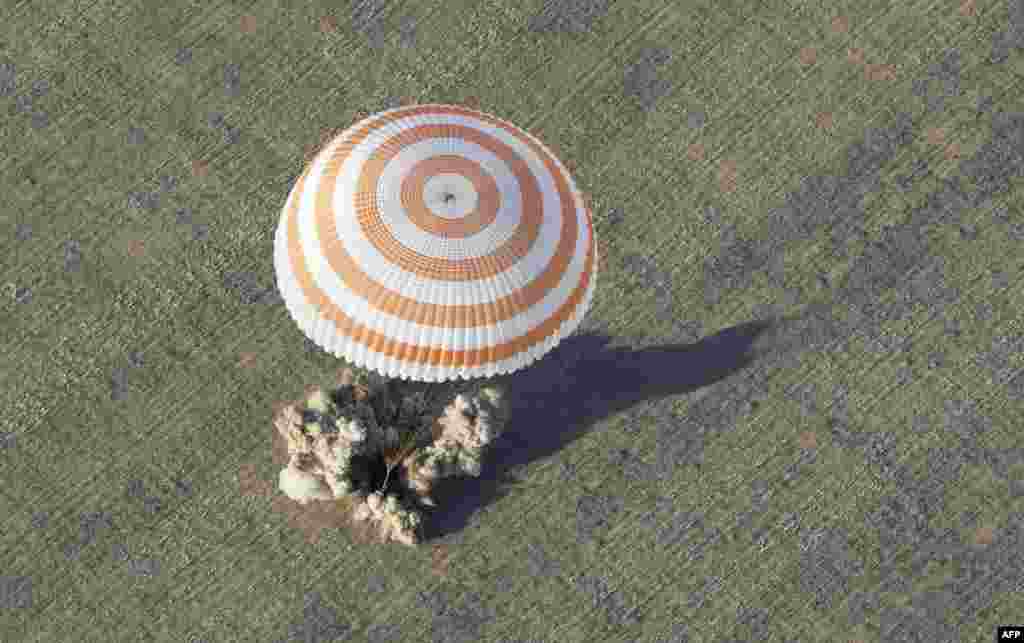 One small steppe for man: The Soyuz capsule is captured at the moment of touchdown near the town of Arkalyk in central Kazakhstan on September 17.