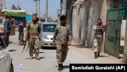 Afghan National Army soldiers patrol during fighting between Taliban and Afghan security forces in inthe noreastern city of Kunduz on June 24.