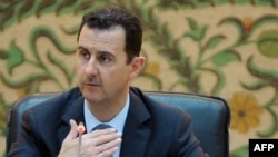 Syrian President Bashar Assad vows to fight terrorists and rules out foreign resolution to country's 16-month-old crisis.