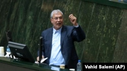 Iranian Labor Minister Ali Rabiei speaks during his impeachment hearing in an open session of parliament in Tehran on August 8.