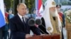 Russian President Vladimir Putin (left) and Patriarch Kirill (file photo)