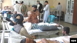 Afghans injured in a coalition air strike, one of the major causes of civilian casualties