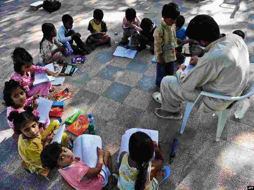 Students attend school in Islamabad, Pakistan. About 45 percent of the population is illiterate. - Plan B emphasizes stabilizing global population by 2020 in order to reduce the demand on natural systems. Population stabilization includes many components that would be included in the plan's $185 billion annual budget. The plan includes $10 billion a year for global, universal primary education.