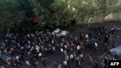 Opposition protestors in the streets of central Tehran weeks after the June election that they dismissed as fraudulent.