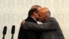 Pakistani Prime Minister Nawaz Sharif (left) and Afghan President Ashraf Ghani hug during Sharif's visit to Kabul on May 12.