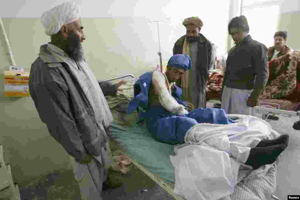 An Afghan man receives treatment in a Herat hospital after he was wounded during the attack.