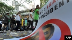 Protesters shout slogans against Iranian leader Mahmud Ahmadinejad in front of the United Nations during the General Assembly.