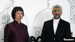 European Union foreign policy chief Catherine Ashton (left) with Iran's chief negotiator Said Jalili in Baghdad on May 23