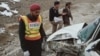 The rescue team from Balochistan's Medical Emergency Response Center at the site of a crash on May 31.