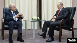 Russian President Vladimir Putin (right) meets with FIFA President Sepp Blatter in Sochi on April 20.