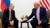 U.S. President Donald Trump gestures during a bilateral meeting with Russian President Vladimir Putin at a Group of 20 leaders summit in Osaka, Japan, last year. 