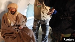 Saif al-Islam Qaddafi is pictured sitting in a plane in Zintan on November 19.