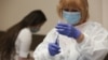 A health worker in Bulgaria prepares an inoculation using the AstraZeneca vaccine in February. (file photo)