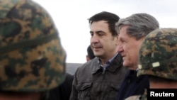 Georgian President Mikheil Saakashvili (left) with U.S. special envoy to Pakistan and Afghanistan Richard Holbrooke at Krtsanisi National Military Training Center in late February.